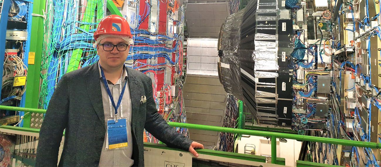 a man with helmet in a factory